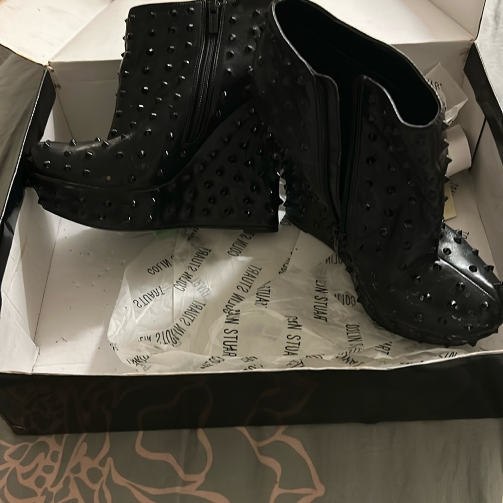 Spiked wedge booties. Genuine leather